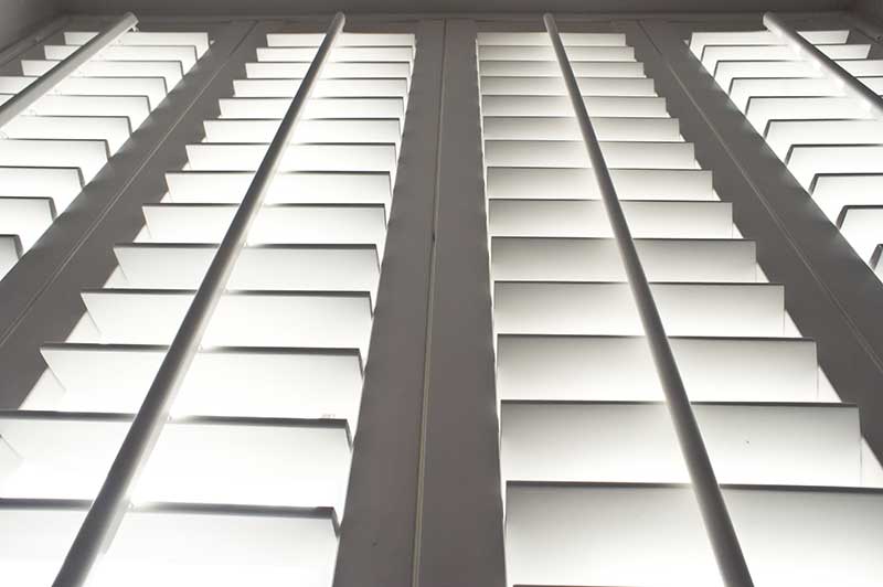 low angle shot of white shutters